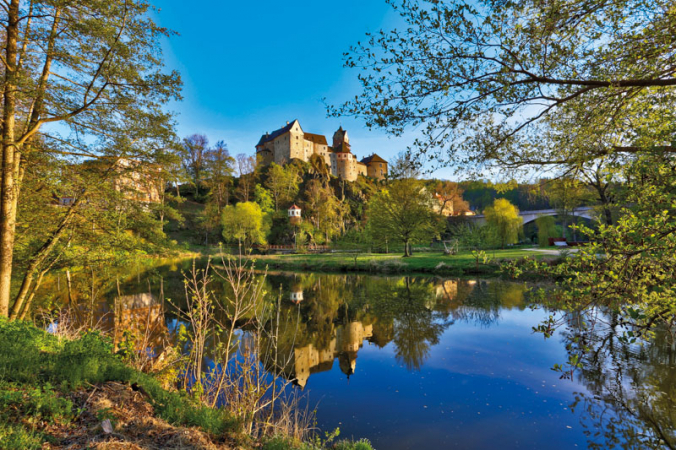 Loket Castle reflected in the River Ohře